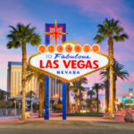 The image shows the iconic "Welcome to Fabulous Las Vegas, Nevada" sign in front of palm trees and a backdrop of city lights at sunset, reminiscent of effective solutions seamlessly blending hues of pink, purple, and blue across the sky.